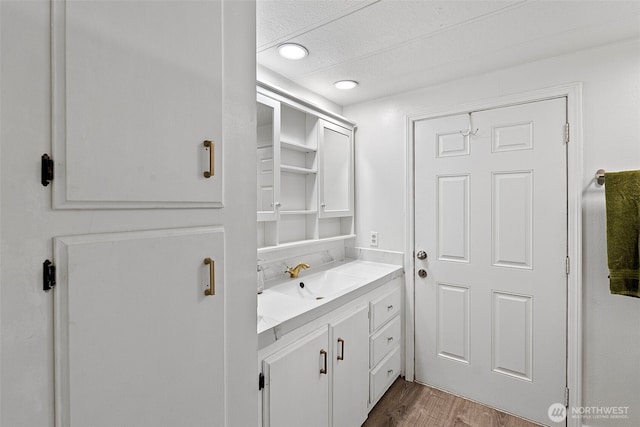 16300 State Highway 305 NE Unit 94, Poulsbo, WA 98370 - laundry room featuring dark wood finished floors and a textured ceiling