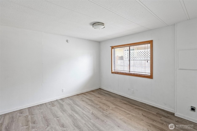 16300 State Highway 305 NE Unit 94, Poulsbo, WA 98370 - unfurnished room with wood finished floors and a textured ceiling