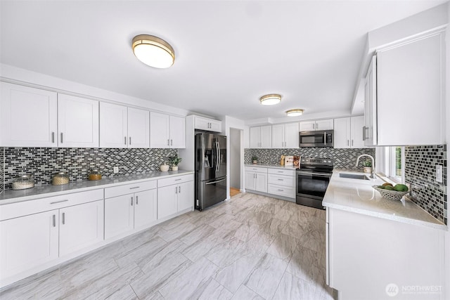 12219 SE 64th Pl, Bellevue, WA 98006 - kitchen featuring appliances with stainless steel finishes, tasteful backsplash, a sink, light countertops, and white cabinets
