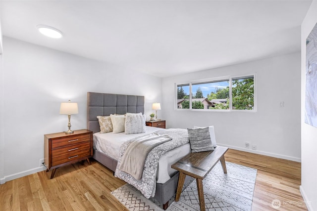 12219 SE 64th Pl, Bellevue, WA 98006 - bedroom with light wood-type flooring and baseboards