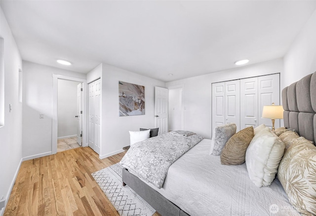 12219 SE 64th Pl, Bellevue, WA 98006 - bedroom featuring light wood-type flooring, baseboards, and recessed lighting