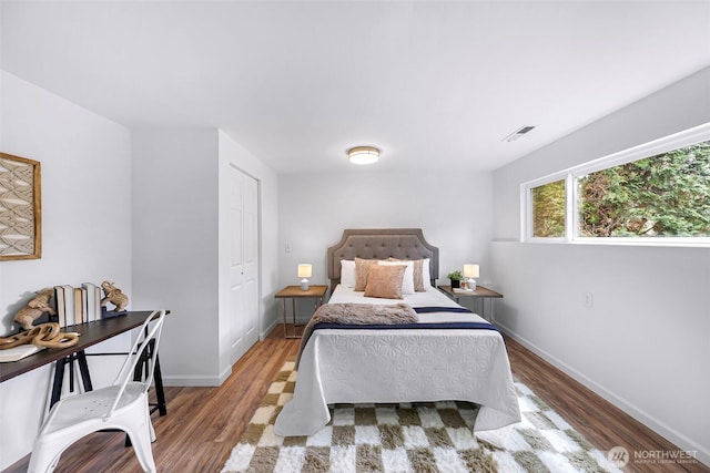 12219 SE 64th Pl, Bellevue, WA 98006 - bedroom featuring wood finished floors and baseboards