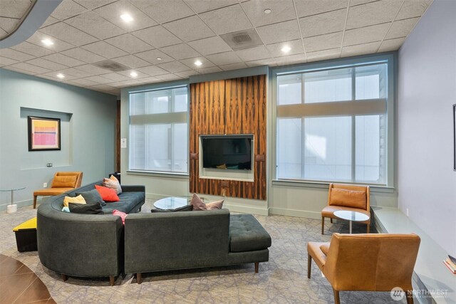 living room with baseboards and recessed lighting