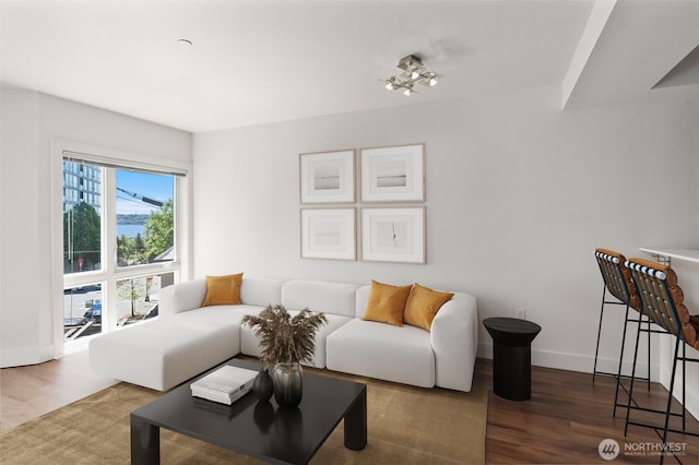 living room with wood finished floors and baseboards