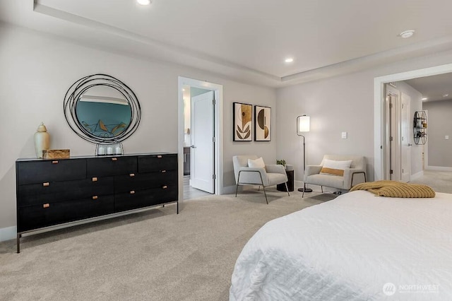 bedroom featuring light carpet, a raised ceiling, baseboards, and recessed lighting