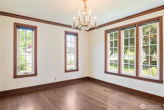 1639 21st Ave, Longview, WA 98632 - unfurnished room featuring dark wood-type flooring, a chandelier, baseboards, and ornamental molding
