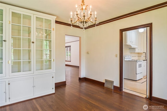 1639 21st Ave, Longview, WA 98632 - spare room with a chandelier, baseboards, dark wood-style flooring, and ornamental molding