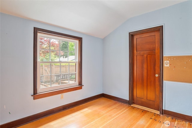 1639 21st Ave, Longview, WA 98632 - unfurnished room with vaulted ceiling, light wood-style flooring, and baseboards