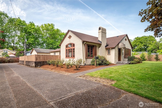 1639 21st Ave, Longview, WA 98632 - view of front facade with a chimney, stucco siding, and a shingled roof