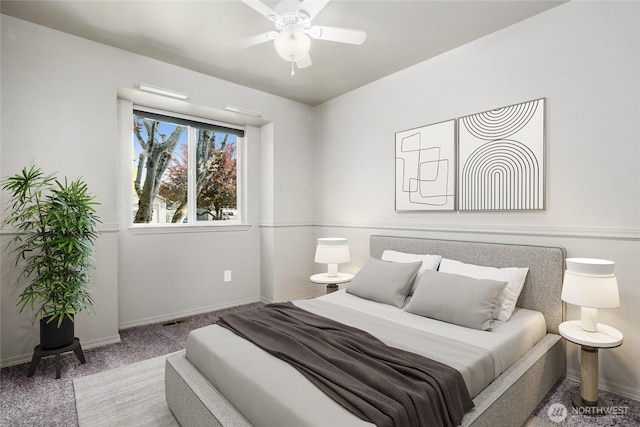 bedroom featuring carpet, baseboards, and a ceiling fan