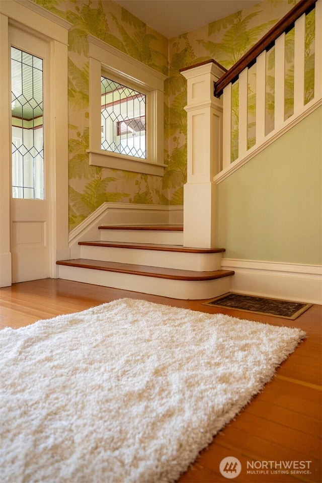 2234 Main St, Ferndale, WA 98248 - stairs featuring wallpapered walls, wood finished floors, and healthy amount of natural light