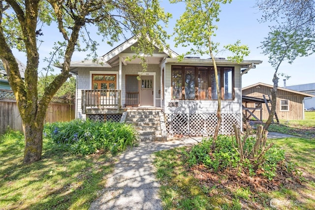 219 W 15th St, Port Angeles, WA 98362 - bungalow-style house featuring a porch and fence