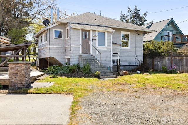 219 W 15th St, Port Angeles, WA 98362 - bungalow-style house featuring entry steps, roof with shingles, and fence