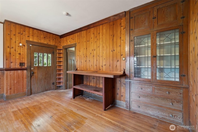 219 W 15th St, Port Angeles, WA 98362 - foyer entrance featuring baseboards, ornamental molding, light wood finished floors, and wood walls