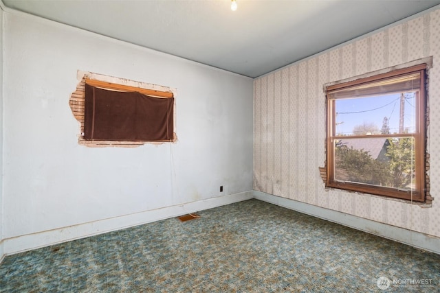 219 W 15th St, Port Angeles, WA 98362 - carpeted empty room featuring baseboards and wallpapered walls
