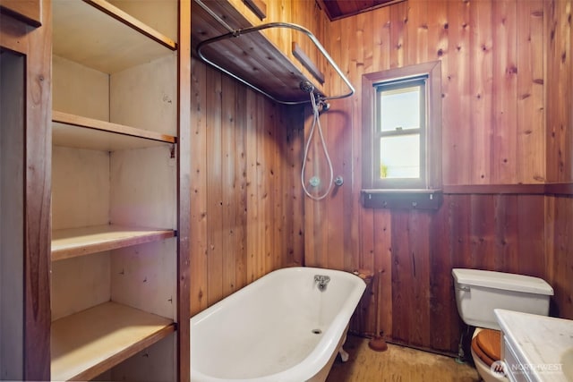 219 W 15th St, Port Angeles, WA 98362 - bathroom featuring walk in shower, wood walls, toilet, vanity, and a freestanding bath