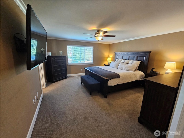 bedroom with light colored carpet, crown molding, baseboards, and ceiling fan