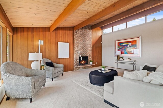 517 S 212th St, Des Moines, WA 98198 - living room with wood ceiling, beamed ceiling, carpet, a fireplace, and wooden walls