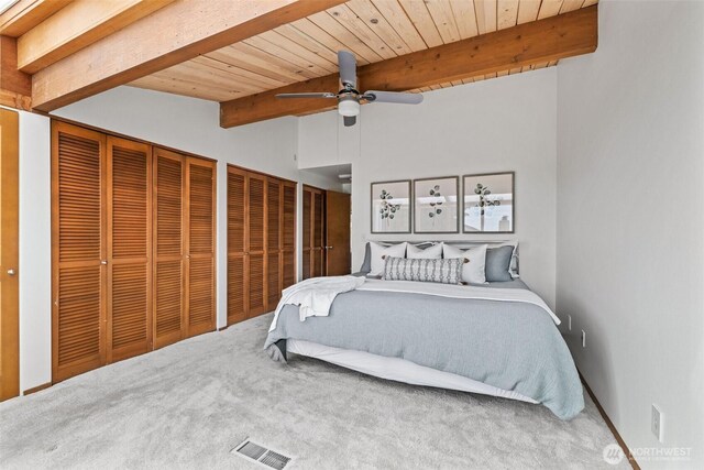 517 S 212th St, Des Moines, WA 98198 - carpeted bedroom with two closets, wood ceiling, and ceiling fan