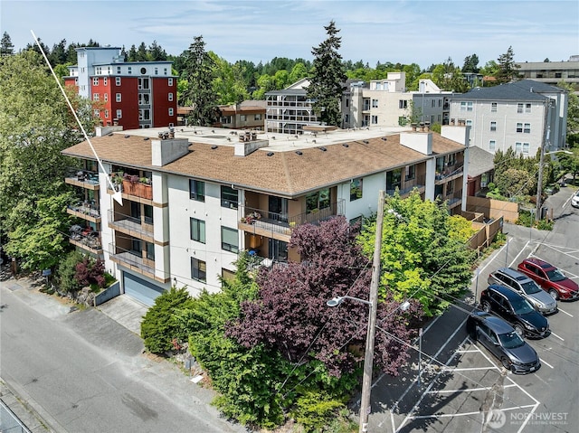 10601 Bagley Ave N Unit 204, Seattle, WA 98133 - view of building exterior with a garage