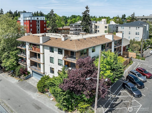 10601 Bagley Ave N Unit 204, Seattle, WA 98133 - view of building exterior featuring an attached garage