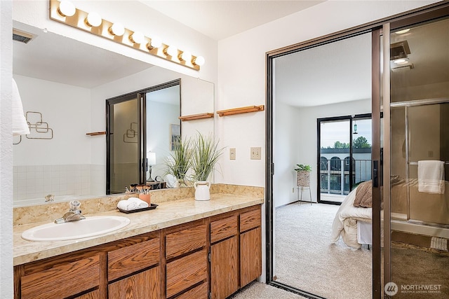 10601 Bagley Ave N Unit 204, Seattle, WA 98133 - full bathroom with vanity, connected bathroom, and a shower with shower door