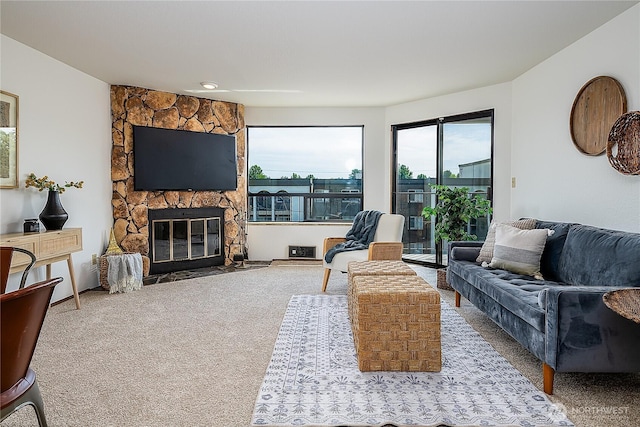 10601 Bagley Ave N Unit 204, Seattle, WA 98133 - carpeted living room with a stone fireplace