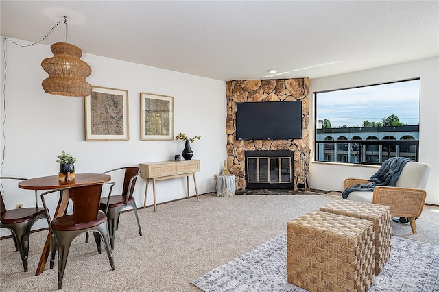 10601 Bagley Ave N Unit 204, Seattle, WA 98133 - carpeted living room featuring a fireplace