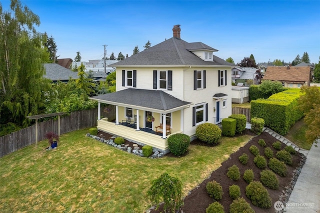 624 S Lawrence St, Tacoma, WA 98405 - rear view of house with covered porch, a chimney, and roof with shingles
