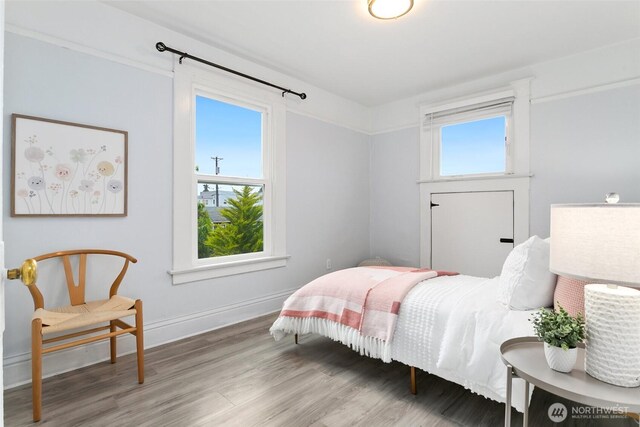 624 S Lawrence St, Tacoma, WA 98405 - bedroom featuring wood finished floors and baseboards
