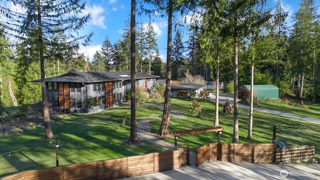 view of home's community with a lawn