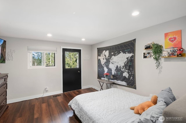 bedroom with recessed lighting, baseboards, visible vents, and wood finished floors