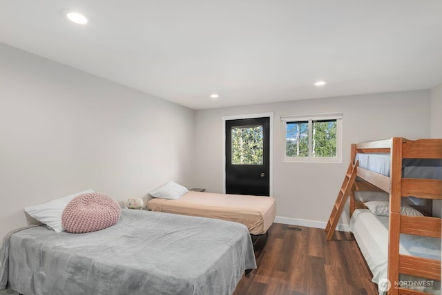 bedroom with baseboards, dark wood-style flooring, and recessed lighting
