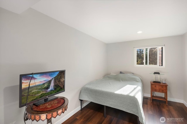 bedroom featuring wood finished floors, baseboards, and recessed lighting
