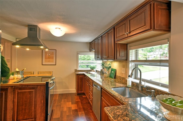 10733 14th Ave NE, Seattle, WA 98125 - kitchen with island exhaust hood, stainless steel appliances, a sink, dark wood finished floors, and baseboards