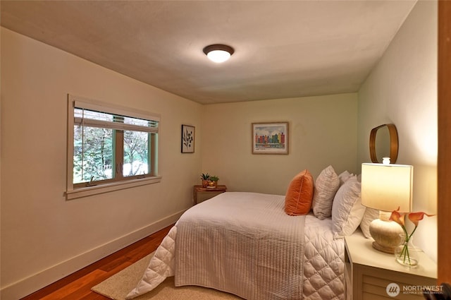 10733 14th Ave NE, Seattle, WA 98125 - bedroom with baseboards and wood finished floors