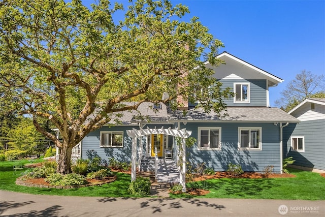 view of front of home featuring roof with shingles and french doors