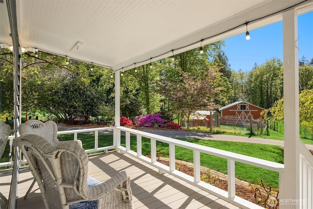 wooden terrace with a yard