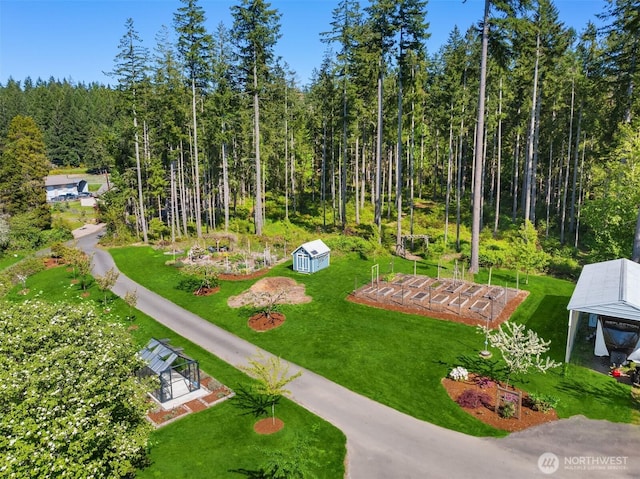 aerial view featuring a wooded view