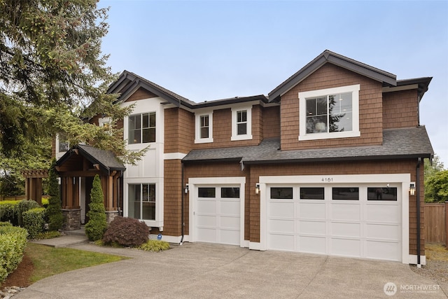 4161 86th Ave SE, Mercer Island, WA 98040 - view of front of home featuring a garage, concrete driveway, a shingled roof, and fence