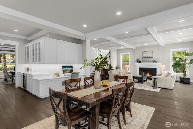 4161 86th Ave SE, Mercer Island, WA 98040 - dining room with recessed lighting, beverage cooler, dark wood finished floors, a glass covered fireplace, and beam ceiling