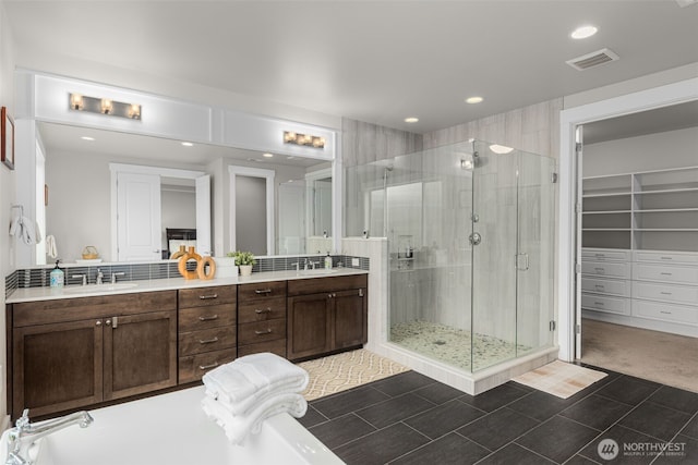 4161 86th Ave SE, Mercer Island, WA 98040 - full bath featuring a stall shower, double vanity, recessed lighting, a spacious closet, and tile patterned flooring