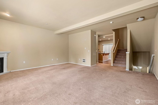5305 Military Rd E Unit D, Tacoma, WA 98446 - unfurnished living room featuring light carpet, baseboards, stairs, and recessed lighting