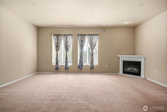 5305 Military Rd E Unit D, Tacoma, WA 98446 - unfurnished living room with carpet floors, a glass covered fireplace, and baseboards