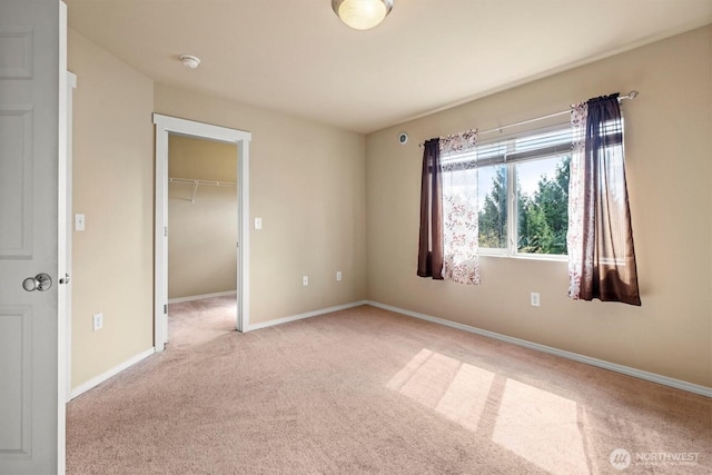 5305 Military Rd E Unit D, Tacoma, WA 98446 - unfurnished bedroom with light carpet, baseboards, a spacious closet, and a closet