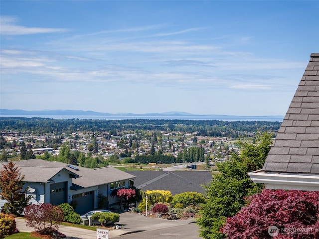 view of mountain backdrop featuring nearby suburban area