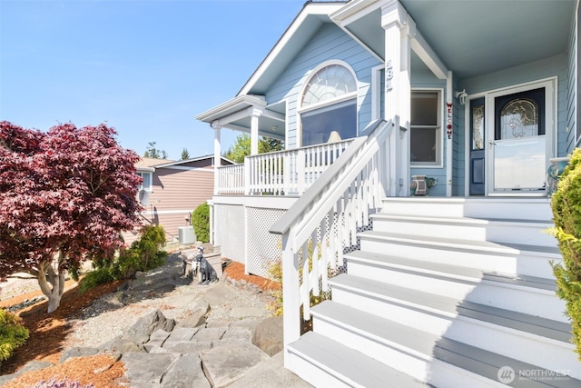 entrance to property featuring covered porch