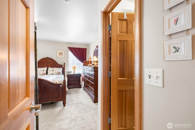 bedroom with light carpet