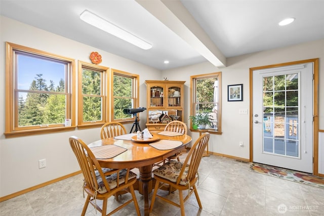 dining area featuring baseboards, light tile patterned floors, and recessed lighting
