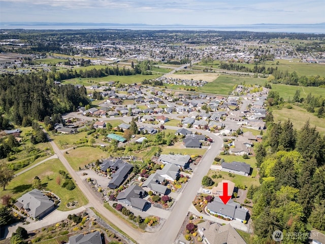 aerial overview of property's location with nearby suburban area